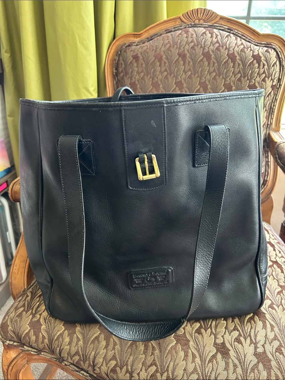 Dooney & Bourke Black Leather Tote Bag with Brass Buckle and Feet